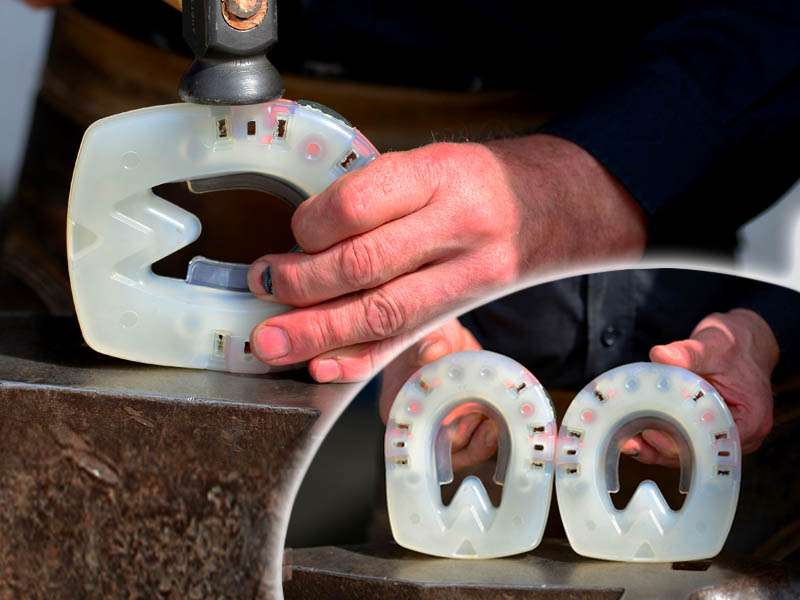 A farrier presents a narrowly forged composite horseshoe.