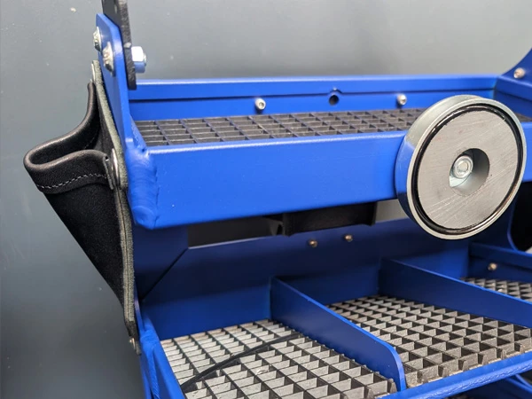 The Blacksmith Tool Box Air 300 includes side-mounted leather pockets for storing hoof knives.